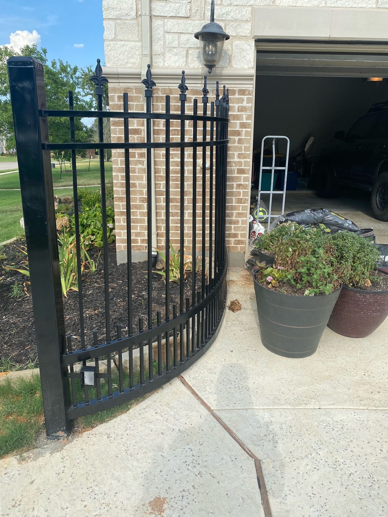 Wrought iron gate on a brick property
